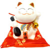 Tirelire chat porte bonheur sur coussin rouge